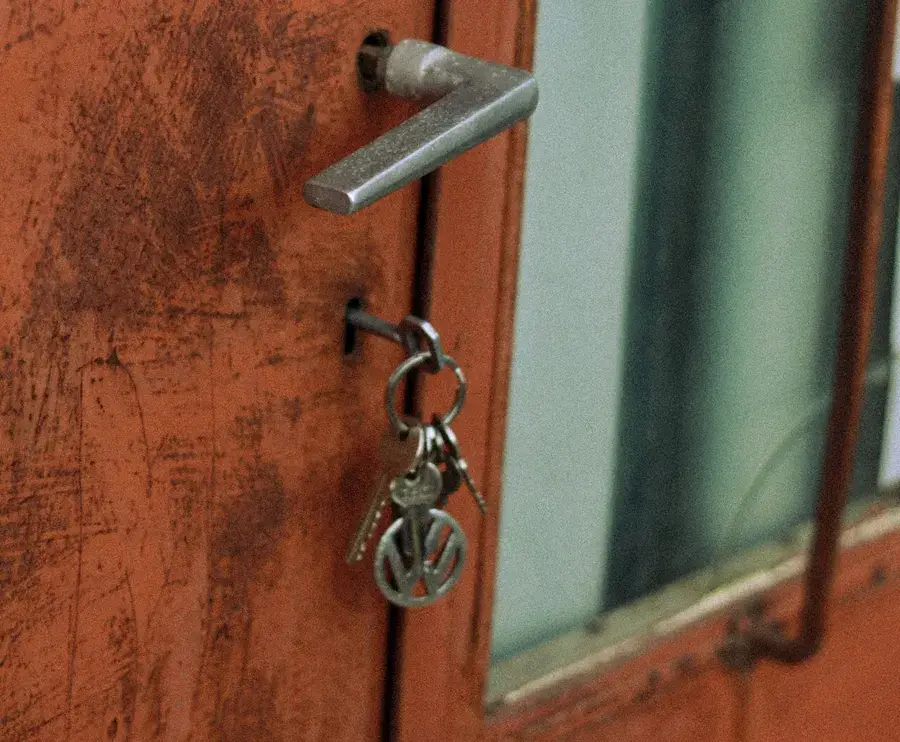 Keys hanging from the lock of an old door – why keys snap and when broken key removal Wilmslow is needed, Locksmith Wilmslow