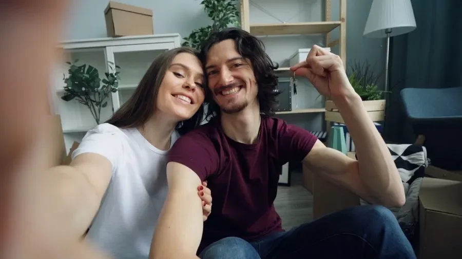 Couple holding up keys in their new home – residential locksmith Wilmslow help for homeowners from Locksmith Wilmslow